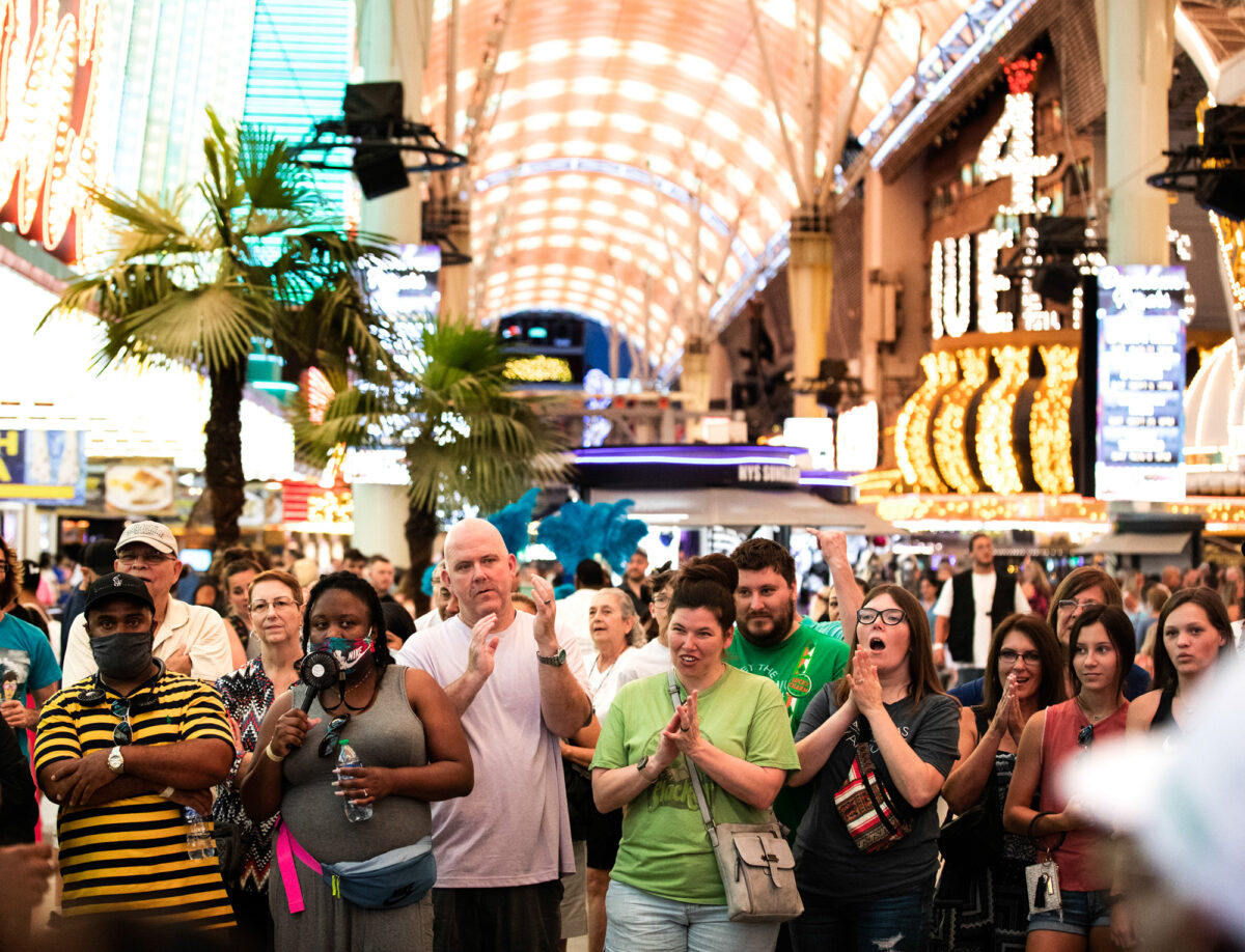 Visitors to Fremont Street Experience watch a street performer on Thursday, July 8, 2021. (Jeff Scheid/Nevada Independent)